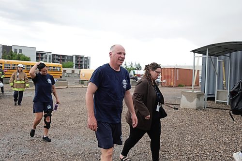 Ruth Bonneville / Free Press

LOCAL - Gillingham fire training

Photo of Mayor Scott Gillingham and Councillor Vivian Santos heading to scrum with the media after the fire training event. 

Mayor Scott Gillingham and Councillor Vivian Santos participate in the Winnipeg Fire Paramedic Service's Fire Dynamics training program involving being inside a full-involved in a sea can Monday.

See story by Joyana

June 15, 2026