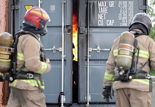 Ruth Bonneville / Free Press

LOCAL - Gillingham fire training

Photo of Fire Fighters with the training academy standing by as Mayor Scott Gillingham and Councillor Vivian Santos are in the sea can on fire.

Mayor Scott Gillingham and Councillor Vivian Santos participate in the Winnipeg Fire Paramedic Service's Fire Dynamics training program involving being inside a full-involved in a sea can Monday.

See story by Joyana

June 15, 2026
