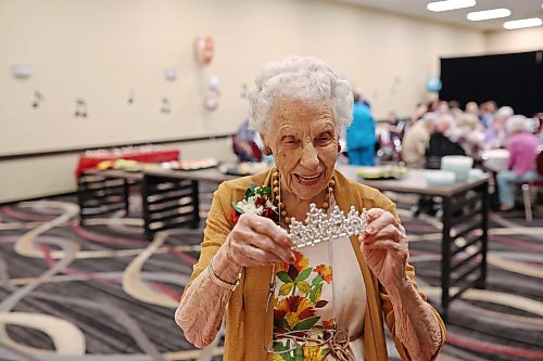 16062026
One-hundred-and-five year old Edith Edmundson laughs while trying on a tiara gifted to her by longtime friend Georgette Ashcroft during her birthday celebration at the Victoria Inn in Brandon, Manitoba on Tuesday. Edmundson turned 105 on June fourth and is celebrating her birthday four times. Festivities started last week in B.C. where Edmundson has been living with her daughter Rhonda Kremko for the last four years. Last Saturday friends and relatives raised a glass to her in Shoal Lake. Her fourth party will be this weekend in Winnipeg. (Tim Smith/The Brandon Sun)