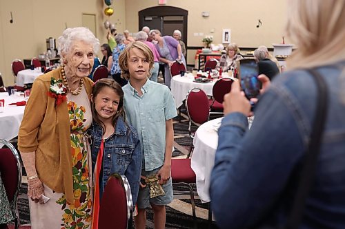 16062026
Edith Edmundson poses for photos with Aspen and Brixten Ashcroft, family friends, during her 105th birthday celebration at the Victoria Inn in Brandon, Manitoba on Tuesday. Edmundson turned 105 on June fourth and is celebrating her birthday four times. Festivities started last week in B.C. where Edmundson has been living with her daughter Rhonda Kremko for the last four years. Last Saturday friends and relatives raised a glass to her in Shoal Lake. Her fourth party will be this weekend in Winnipeg. (Tim Smith/The Brandon Sun)