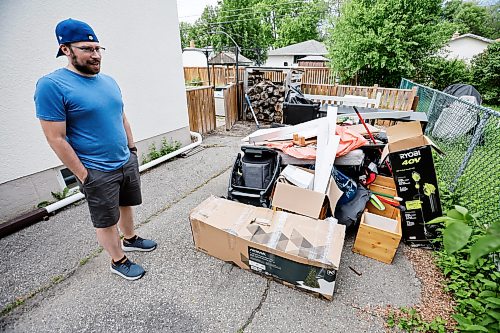 JOHN WOODS / FREE PRESS
Andrew Van Seggelen is photographed Tuesday, June 16, 2026 with water damaged items outside his home after his basement was flooded twice in the past week. 

reporter: modjeski