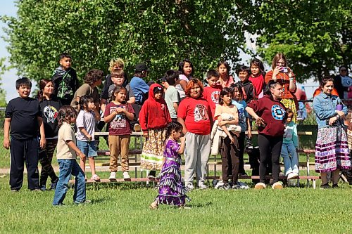 17062026
Students at Chan Kagha Otina Dakota Wayawa Tipi School watch dancers take part in the grand entry for the school’s annual end-of-year Pow wow at Birdtail Sioux Dakota Nation on Wednesday. The event included a lunch and prizes in various pow wow categories. Chan Kagha Otina Dakota Wayawa Tipi School has approximately 210 students from nursery school up to adult education. School principal Delonna Pratt said the annual pow wow is “a celebration of the school year and coincides with the upcoming summer solstice.” She added “in Dakota Culture there is a lot of connection to the earth so we make sure to give our thanks to creator every day for what we have.” (Tim Smith/The Brandon Sun)