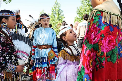 17062026
Young dancers wait to take part in the grand entry for Chan Kagha Otina Dakota Wayawa Tipi School’s annual end-of-year Pow wow at Birdtail Sioux Dakota Nation on Wednesday. The event included a lunch and prizes in various pow wow categories. Chan Kagha Otina Dakota Wayawa Tipi School has approximately 210 students from nursery school up to adult education. School principal Delonna Pratt said the annual pow wow is “a celebration of the school year and coincides with the upcoming summer solstice.” She added “in Dakota Culture there is a lot of connection to the earth so we make sure to give our thanks to creator every day for what we have.” (Tim Smith/The Brandon Sun)