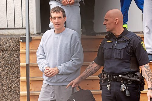 Michael Man of Russell is escorted out of provincial court at the Rossburn Community Hall by sheriffs on Wednesday after a sentencing hearing. Man, 45, plead guilty in February to three counts of uttering threats. (Tim Smith/The Brandon Sun)