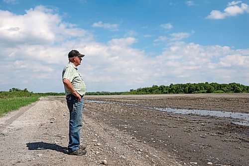 Lifelong farmer Stan Cochrane looks over one of his fields bordering the Assiniboine River east of Sioux Valley Dakota Nation in early June. Cochrane started fortifying dikes on his farmland on Thursday in preparation for an expected peak in the river next week due to rain and flooding upstream. (Tim Smith/The Brandon Sun files)