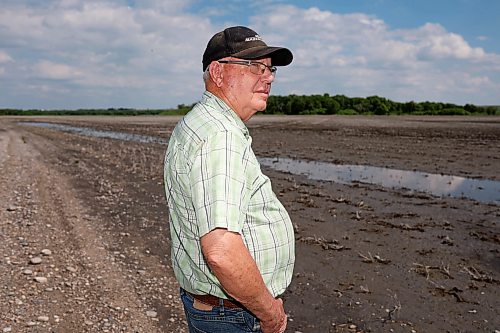 Lifelong farmer Stan Cochrane looks over one of his fields bordering the Assiniboine River east of Sioux Valley Dakota Nation in early June. Cochrane started fortifying dikes on his farmland on Thursday in preparation for an expected peak in the river next week due to rain and flooding upstream. (Tim Smith/The Brandon Sun files)