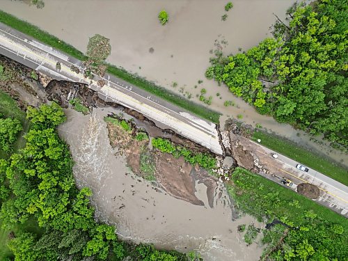Damage to Highway 10 at Tamarack Creek, just east of Swan River, is visible last week after intense rainfall caused the river to swell. (Tim Smith/The Brandon Sun files)