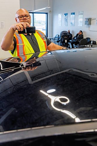 MIKE DEAL / FREE PRESS
MPI Estimator, Mike Head, checks out the hail damage to a claimants car.
John Bowering, Vice President and Chief Claims Officer talks to media about MPI’s dedicated Hail Response Centre located at its Gateway Service Centre, 40 Lexington Park, while clients arrive for their appointments Thursday morning.
MPI says this is one of the largest claims events in its history. 
Reporter: Chris Kitching
260618 - Thursday, June 18, 2026.