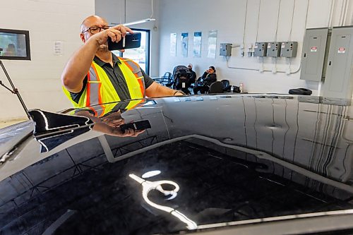 MIKE DEAL / FREE PRESS
MPI Estimator, Mike Head, checks out the hail damage to a claimants car.
John Bowering, Vice President and Chief Claims Officer talks to media about MPI’s dedicated Hail Response Centre located at its Gateway Service Centre, 40 Lexington Park, while clients arrive for their appointments Thursday morning.
MPI says this is one of the largest claims events in its history.
Reporter: Chris Kitching
260618 - Thursday, June 18, 2026.