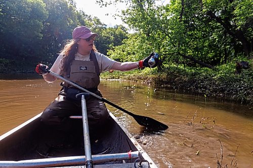 MIKE DEAL / FREE PRESS
Monique Ellison, Summer Team Coordinator with the Save Our Seine cleanup crew, empties an aluminum can from the bank of the river Thursday morning. The crew of usually three is out most nice days paddling their way along the Seine River filling up their canoe with heaps of garbage. The portion of the Seine River in the city they are charged with protecting is about 26kms long and they will cover that distance at least four times during the next few months removing garbage and making sure the river is kept as healthy as possible.
Every day they are in the river they collect about truck load of garbage, sometimes two loads depending on the stretch of the river they are canoeing that day.
260618 - Thursday, June 18, 2026.