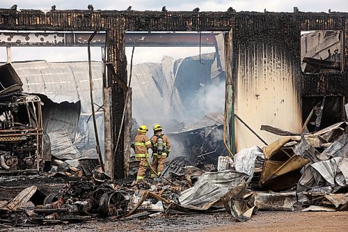 18062026
Firefighters from the Oakland-Wawanesa Fire Department, the Souris-Glenwood Fire Department and Green Acres Colony worked to put out a fire that destroyed the colony’s garage next to their mechanic shop and several vehicles on Thursday. The fire spread through the garage quickly. Several members of the colony are part of the Oakland-Wawanesa Fire Department. 
(Tim Smith/The Brandon Sun)