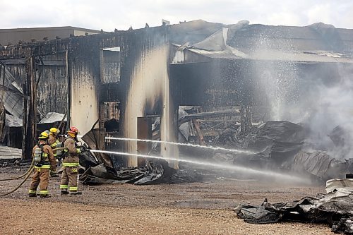 18062026
Firefighters from the Oakland-Wawanesa Fire Department, the Souris-Glenwood Fire Department and Green Acres Colony work to put out a fire that destroyed the colony’s garage next to their mechanic shop and several vehicles on Thursday. 
(Tim Smith/The Brandon Sun)