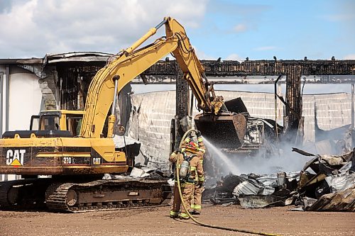 18062026
Firefighters from the Oakland-Wawanesa Fire Department, the Souris-Glenwood Fire Department and Green Acres Colony worked to put out a fire that destroyed the colony’s garage next to their mechanic shop and several vehicles on Thursday. The fire spread through the garage quickly. Several members of the colony are part of the Oakland-Wawanesa Fire Department.
(Tim Smith/The Brandon Sun)