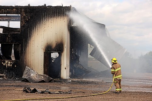 18062026
Firefighters from the Oakland-Wawanesa Fire Department, the Souris-Glenwood Fire Department and Green Acres Colony worked to put out a fire that destroyed the colony’s garage next to their mechanic shop and several vehicles on Thursday. The fire spread through the garage quickly. Several members of the colony are part of the Oakland-Wawanesa Fire Department. 
(Tim Smith/The Brandon Sun)