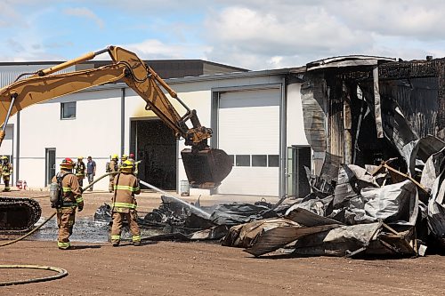 18062026
Firefighters from the Oakland-Wawanesa Fire Department, the Souris-Glenwood Fire Department and Green Acres Colony worked to put out a fire that destroyed the colony’s garage next to their mechanic shop and several vehicles on Thursday. The fire spread through the garage quickly. Several members of the colony are part of the Oakland-Wawanesa Fire Department.
(Tim Smith/The Brandon Sun)