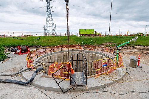 MIKE DEAL / FREE PRESS
The southeastern entrance to the tunnel that has been dug to contain the new sewer pipes that go underneath the Red River alongside the Fort Garry Bridge.
Construction continues on replacing the old failed sewer lines that crossed the Red River at the Fort Garry Bridge, the new ones being installed in a tunnel that goes 16 meters below the ground travelling underneath the river.
Reporter: Morgan Modjeski
260619 - Friday, June 19, 2026.