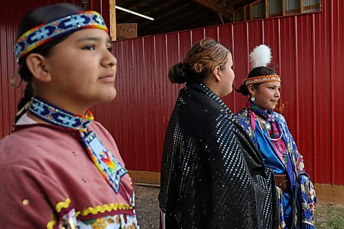 18062026
Dancers Briella Hanska, Jenissa Hotain and Redstar Stonestand prepare for the grand entry at the mini competition powwow during Indigenous Peoples Day celebrations at Sioux Valley Dakota Nation on Friday. The celebrations included live entertainment, a talent show, games, sports, and a barbecue supper, among other festivities. Indigenous Peoples Day is Sunday, June 21 with local celebrations at the Riverbank Discovery Centre. (Tim Smith/The Brandon Sun)