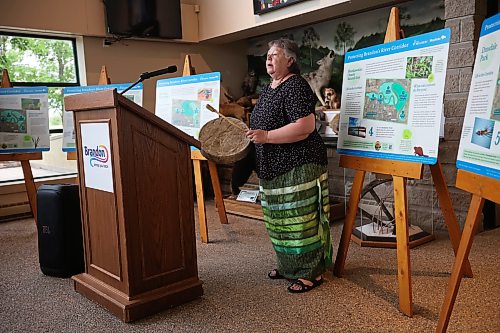 22062026
Knowledge Keeper Debbie Huntinghawk performs a prayer song during an event at the Riverbank Discovery Centre on Monday morning to announce the adding of five city-owned lands to Manitoba’s Protected and Conserved Areas Network.
(Tim Smith/The Brandon Sun)