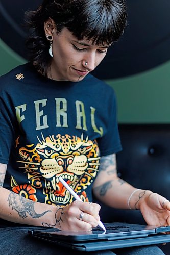 MIKE DEAL / FREE PRESS
Justine Proulx at the Black Thistle Tattoo parlour (853 Henderson Hwy) where she works.
Justine Proulx's clients are bringing her a lot of AI-generated art for tattoo proposals, and some of them are being made in "Justine Proulx" style.
Some prospective clients are feeding the artist's work into AI tools like ChatGPT or Gemini to create versions of tattoos in Proulx's woodlands style; the artist is having none of it.
Reporter: Ben Waldman
260623 - Tuesday, June 23, 2026.
