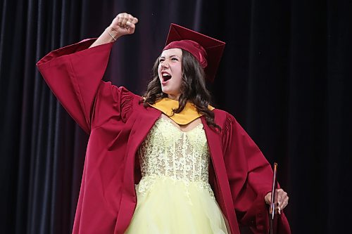 Graduate Eliza Taggart pumps her fist in celebration while receiving her diploma during the Crocus Plains Regional Secondary School 2026 graduation ceremony at Assiniboine Credit Union Place on Tuesday. (Tim Smith/The Brandon Sun)
