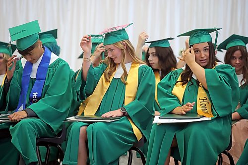 24062026
Graduates move the tassels on their mortarboards from the right side to the left after being presented with their diplomas during École Secondaire Neelin High School’s 2026 convocation at the Brandon University Healthy Living Centre on Wednesday.
(Tim Smith/The Brandon Sun)