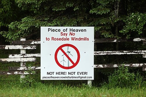 A sign in opposition to proposed windmills in the Polonia area is affixed to a fence along Mountain Road north of Polonia last week. (Tim Smith/The Brandon Sun)