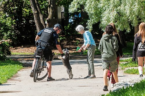 MIKE DEAL / FREE PRESS
One of the WPS officers stops to chat with a person walking their dog in Stephen Juba Park.
A handful of the twenty-five WPS officers that have completed specialized bicycle patrol training were on hand Thursday morning on Waterfront Drive for a show-and-tell of their new e-bikes and the launch of a modernized Bicycle Patrol Program.
Reporter: Erik Pindera
260625 - Thursday, June 25, 2026.