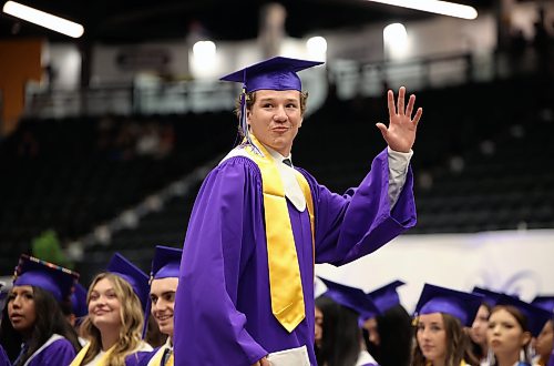 25062026
A graduate waves to supporters after receiving his diploma during Vincent Massey High School’s class of 2026 graduation ceremony at Assiniboine Credit Union Place on Thursday.
(Tim Smith/The Brandon Sun)