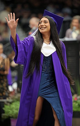 25062026
Jailene Rapalo waves to supporters while walking up to receive her diploma during the Vincent Massey High School class of 2026 graduation ceremony at Assiniboine Credit Union Place on Thursday.
(Tim Smith/The Brandon Sun)
