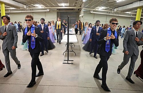 25062026
Graduates are reflected in a mirror as they line up for the grand march at the end of the Vincent Massey High School class of 2026 graduation ceremony at Assiniboine Credit Union Place on Thursday. 
 (Tim Smith/The Brandon Sun)
