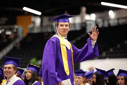 25062026
A graduate waves to supporters after receiving his diploma during Vincent Massey High School’s class of 2026 graduation ceremony at Assiniboine Credit Union Place on Thursday.
(Tim Smith/The Brandon Sun)