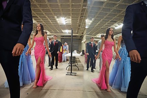 25062026
Graduates are reflected in a mirror as they line up for the grand march at the end of the Vincent Massey High School class of 2026 graduation ceremony at Assiniboine Credit Union Place on Thursday.
(Tim Smith/The Brandon Sun)
