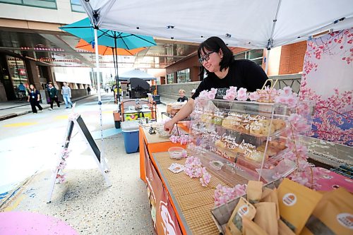 Ruth Bonneville / Free Press
Standup: Graham Farmers' Market
Yuka Katahira, owner and baker of Yuka's Japanese Bakery, displays a wide selection of freshly baked goods at her booth during the Downtown Winnipeg BIZ's popular Outdoor Farmers' Market on Graham Avenue Thursday.
The market, which has brought local food producers, artisans and vendors to downtown Winnipeg for more than 13 years at the Manitoba Hydro campus, has temporarily relocated to Graham Avenue while construction takes place around the Hydro Building.
The Downtown Winnipeg Farmers' Market is open Thursdays from 10 a.m. to 2 p.m.
June 25, 2026