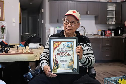 Longtime chess enthusiast Gilbert Perez holds his recognition plaque in his residence after earning top honours in the senior category in both the rapid and blitz events at the 25th International Physically Disabled Chess Association (IPCA) World Individual Chess Championship held in Torrevieja, Spain, earlier this month. (Abiola Odutola/The Brandon Sun)