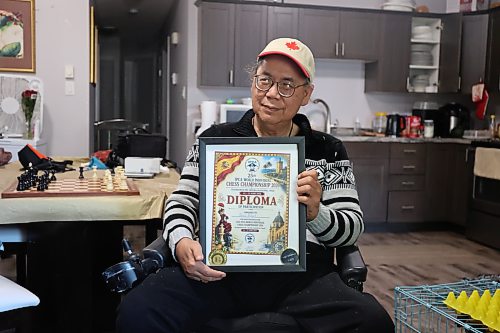 Longtime chess enthusiast Gilbert Perez holds his recognition plaque in his residence on Saturday afternoon. Perez earned top honours in the senior category in both the rapid and blitz events at the 25th International Physically Disabled Chess Association (IPCA) World Individual Chess Championship held in Torrevieja, Spain, from June 1 to 13. (Abiola Odutola/The Brandon Sun)