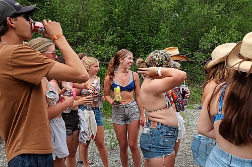 26062026
Festival-goers socialize along the creek that runs past the campground area at Dauphin’s Countryfest 2026 on Friday afternoon.
(Tim Smith/The Brandon Sun)