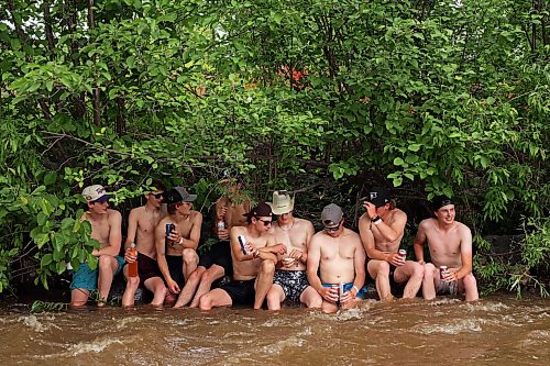 26062026
A group of young men cool their heels in the creek that runs past the campground area at Dauphin’s Countryfest 2026 on Friday afternoon.
(Tim Smith/The Brandon Sun)