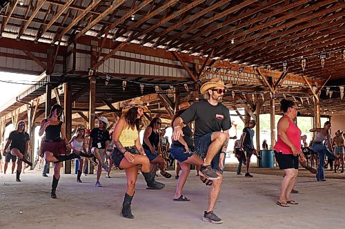 26062026
Festival-goers line-dance at the hilltop stage during Dauphin’s Countryfest 2026 on Friday afternoon.
(Tim Smith/The Brandon Sun)
