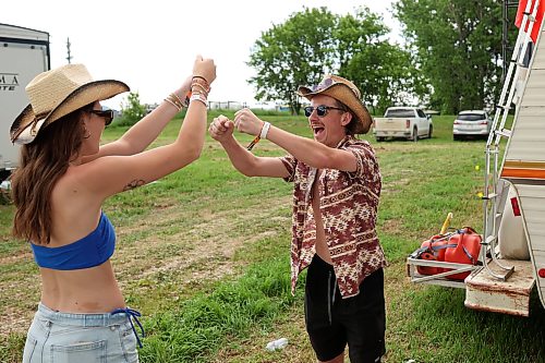 26062026
Mya Plaisier and Cooper McColl celebrate a throw while playing beer pong with friends during Dauphin’s Countryfest 2026 on Friday.
(Tim Smith/The Brandon Sun)