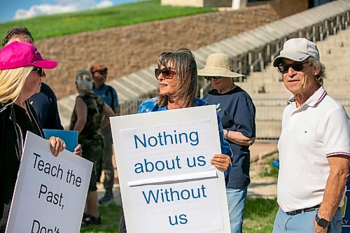 BROOK JONES/FREE PRESS
People gather outside the Canadian Museum for Human Rights to protest a new exhibit, Palestine Uprooted - Nakba Past and Present at the CMHR in Winnipeg, Man., Friday, June 26, 2026. Pictured: Gail Asper (middle), whose late father Izzy Asper founded the museum, holds a sign.