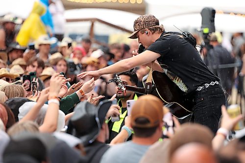 26062026
Canadian country musician Owen Riegling performs on the main stage with his band during light rain at Dauphin’s Countryfest 2026 on Friday evening.
(Tim Smith/The Brandon Sun)
