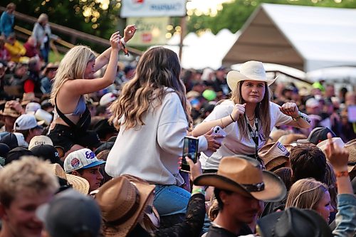 26062026
Fans get a better view atop pairs of shoulders as the Hunter Brothers play on the main stage during Dauphin’s Countryfest 2026 on Friday evening. Tyler Hubbard headlined Friday evening’s main stage line-up.
(Tim Smith/The Brandon Sun)