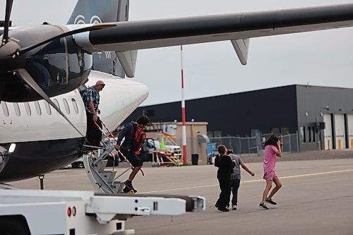 Evacuees from Lynn Lake arrive at the Brandon Municipal Airport on Saturday evening after being forced from their homes for the third time in the last one year. (Abiola Odutola/The Brandon Sun)