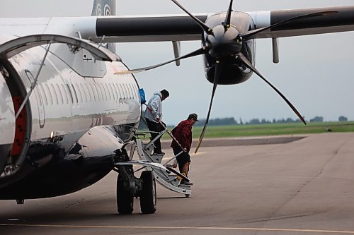 Evacuees from Lynn Lake arrive at the Brandon Municipal Airport on Saturday evening after being forced from their homes for the third time in the last one year. (Abiola Odutola/The Brandon Sun)