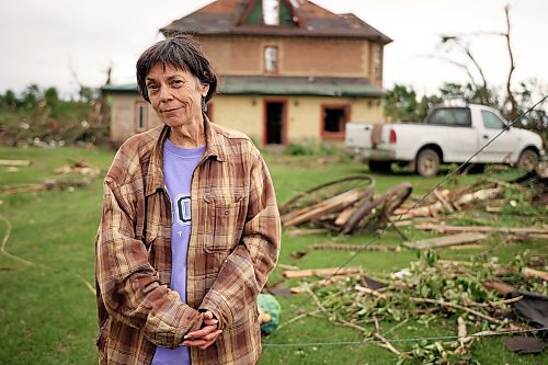 Bernadine Brown stands outside her home on Monday after a powerful tornado heavily damaged their home and property on Sunday evening. (Tim Smith/The Brandon Sun)