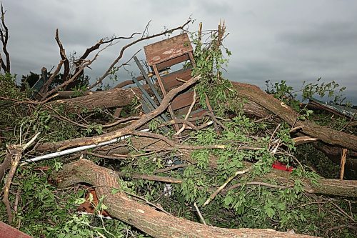 29062026
Damage to vehicles and buildings including a historic barn at the property belonging to Brian and Bernadine Brown south of Rossburn, Manitoba on Monday after a powerful tornado hit the property on Sunday evening while Brian and Bernadine were inside. Their home, several other buildings on the property, vehicles and hundreds of trees were all heavily damaged by the tornado, but luckily escaped uninjured.
(Tim Smith/The Brandon Sun)
