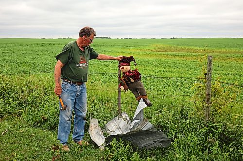 29062026
Brian Brown finds a Christmas decoration that had been inside he and Bernadine’s home, caught up in barbed wire hundreds of feet away from the home on Monday after a powerful tornado destroyed their home and property on Sunday evening. (Tim Smith/The Brandon Sun)