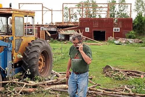 29062026
Brian Brown talks on the phone in front of the Brown’s heavily damaged historic barn on Monday after a powerful tornado destroyed their home and property on Sunday evening.  (Tim Smith/The Brandon Sun)