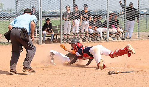 Brandon Marlins base runner Seth Sulik (50) slides across the plate safely as South Central Koen Bleznuk (22) desperately lunges back to tag him under the watchful eye of umpire Bob Blad during the 15-and-under gold medal game at the Triple Crown Showdown at Simplot Millennium Park in 2023. Brandon lost 15-3. The event has set a new record for the number of teams entered over two weekends. (Perry Bergson/The Brandon Sun)
