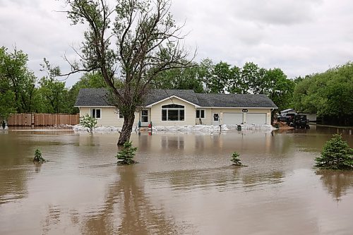 10062026
A home is surrounded by floodwaters along Highway 83 south of Swan River, Manitoba on Wednesday after sustained rainfall earlier in the week caused widespread flooding. (Tim Smith/The Brandon Sun)